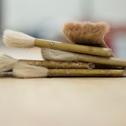 brushes stacked on each other on a table